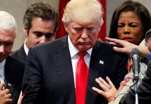 Trump praying before impeachment say a prayer